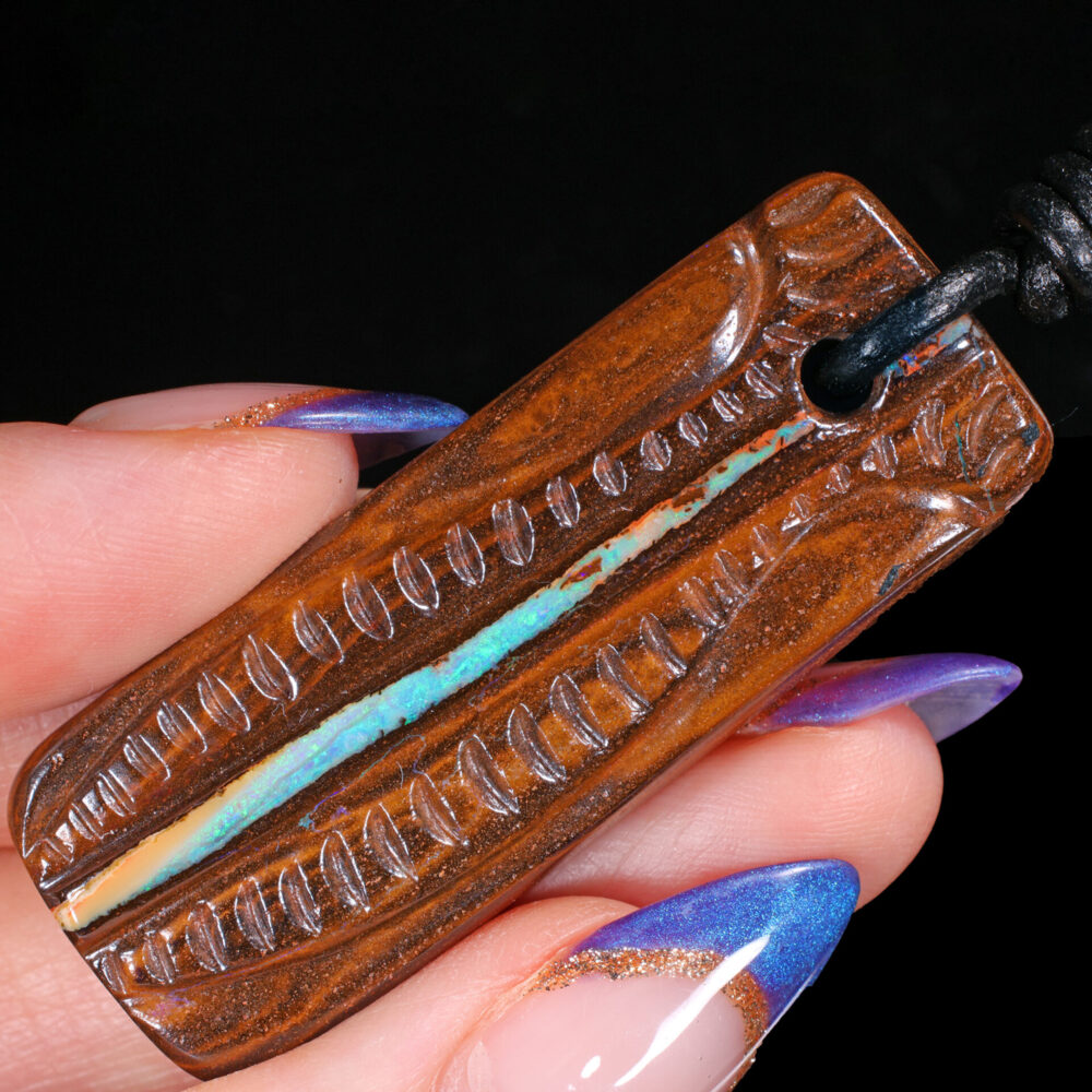 Boulder Opal Pendant 66ct in hand view Australian opal gemstone Opal Galaxy product image