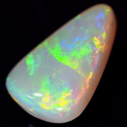 Natural dark opal Lightning Ridge on a black background showing broad green yellow fire.