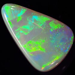 Natural dark opal Lightning Ridge oblique view with rolling green fire across the center.