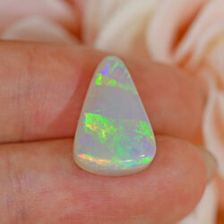 Natural dark opal Lightning Ridge shown from the back with a pale base and natural potch.