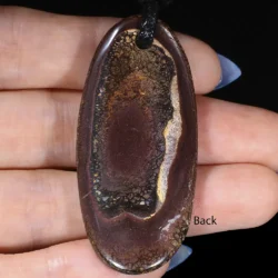 Back view of boulder opal pendant showing natural ironstone matrix backing