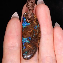 Boulder Opal Pendant 32ct in hand view Australian opal gemstone Opal Galaxy product image