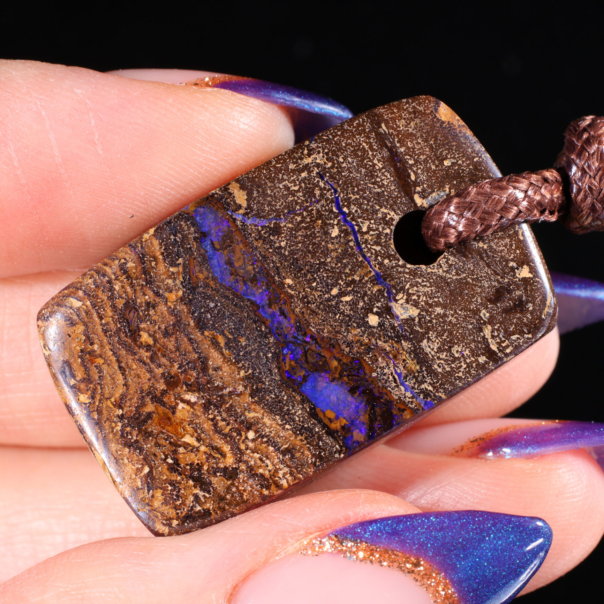 64ct Solid Boulder Opal Pendant Blue Purple Fire angled view Australian opal gemstone Opal Galaxy product image