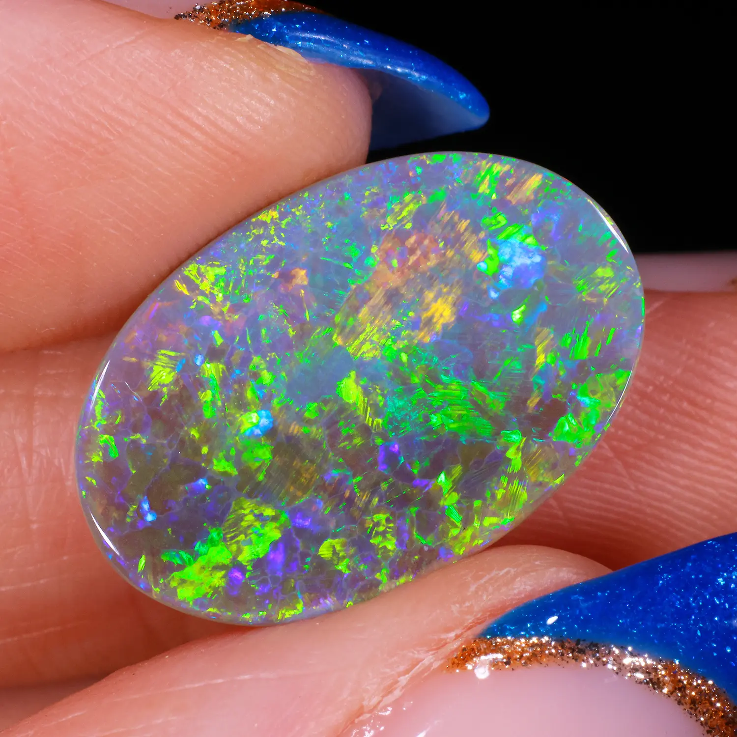 6.84ct Natural Dark Opal - Oval Neon Multicolor-hand shot