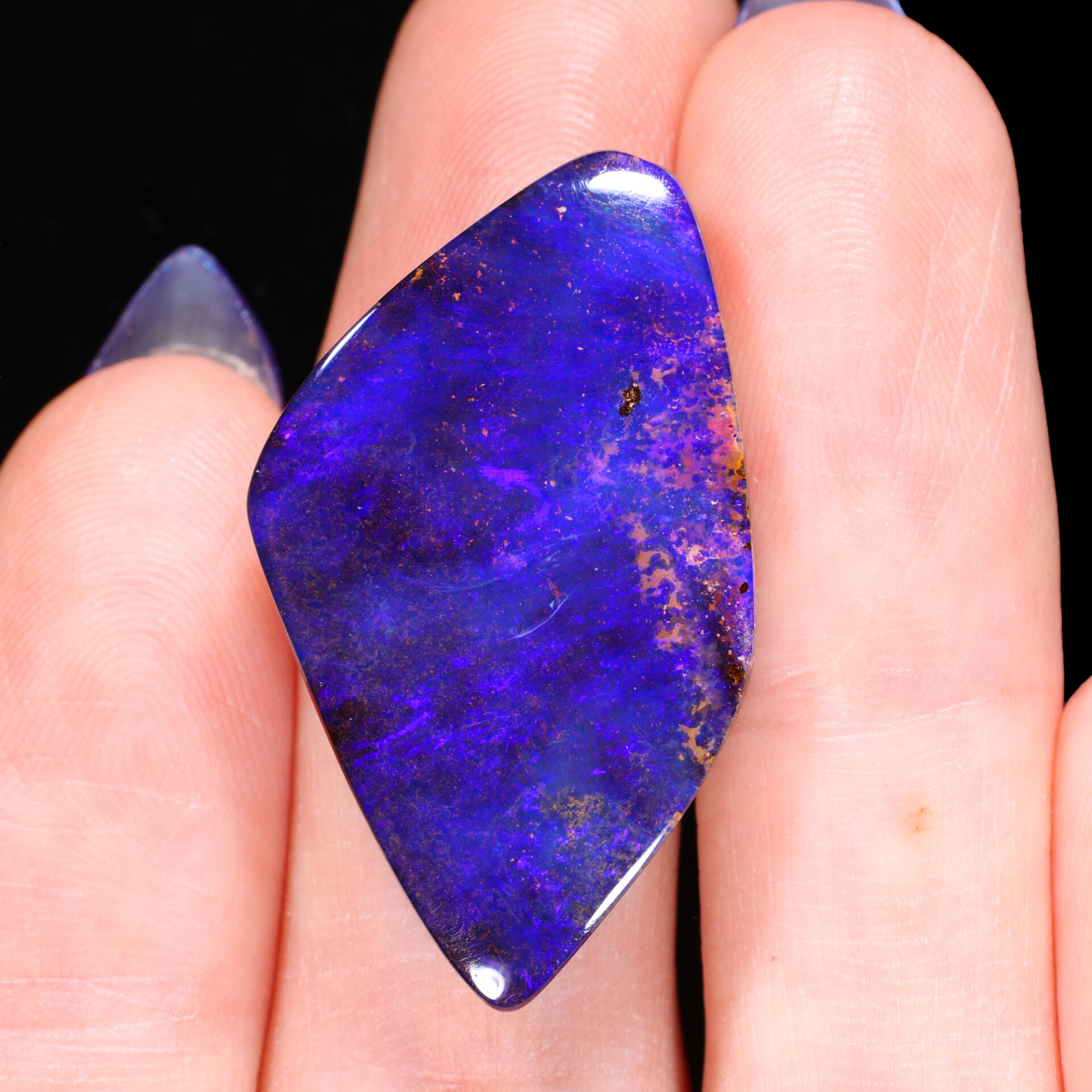 24.8ct Solid Boulder Opal Electric Blue Purple Fire angled view Australian opal gemstone Opal Galaxy product image