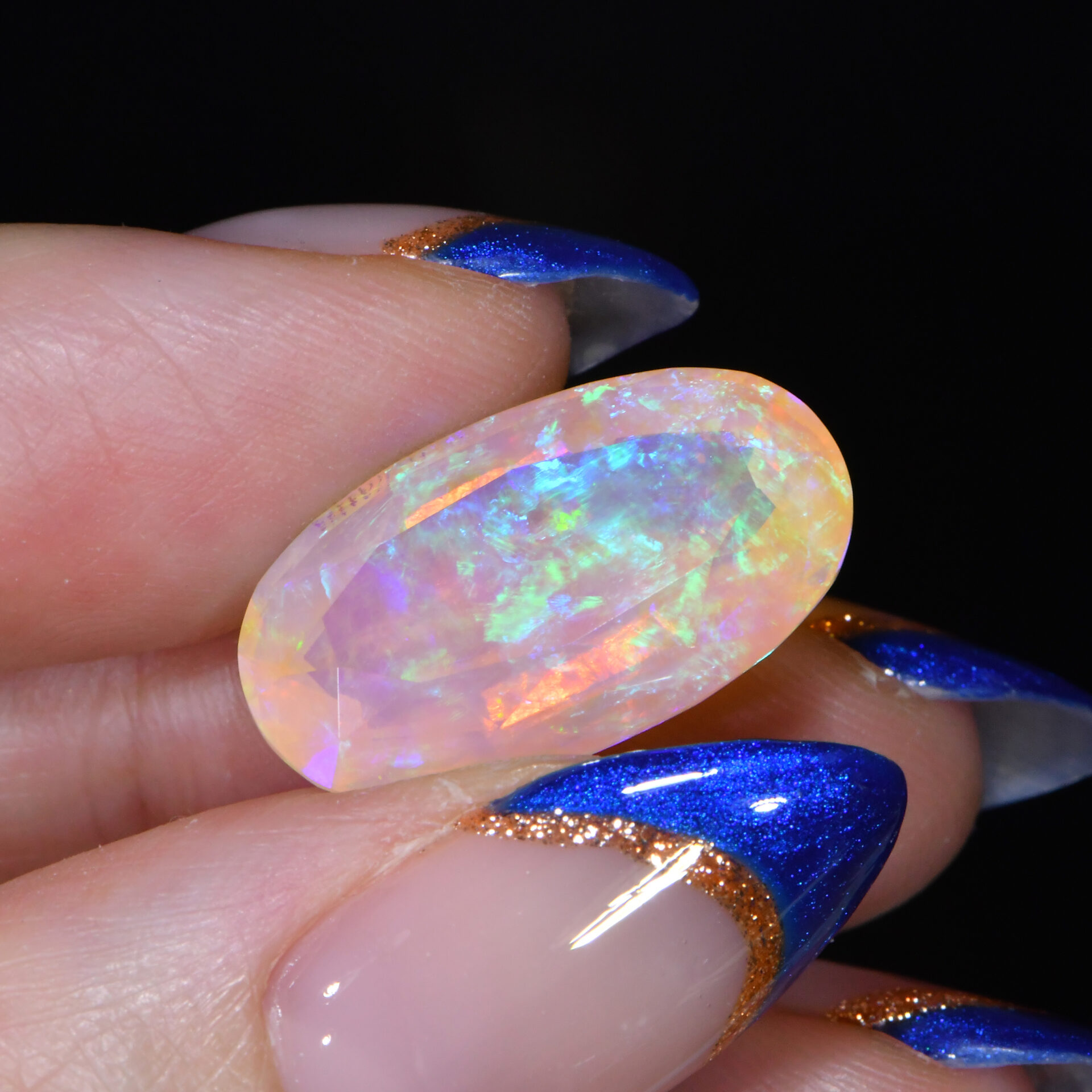 Rare Faceted Crystal Boulder Opal 9.73 ct, 100% Natural Solid Faceted Crystal Boulder Opal From Australia. Oval Shape, Purplish Blue, Green, Cyan, Yellow Fire.
