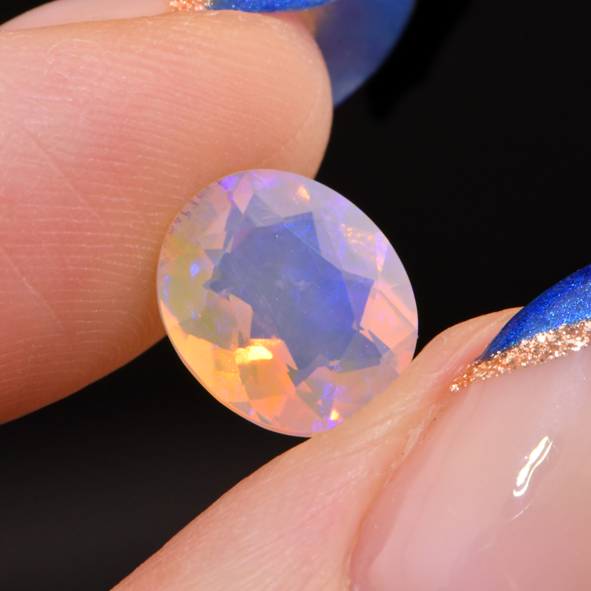Faceted Crystal Opal 1.79 ct-handshot1