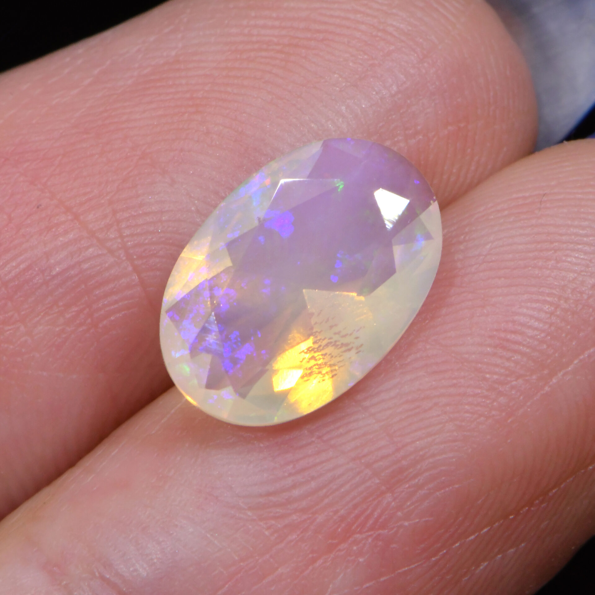 Faceted Crystal Opal 1.95 ct-hand shotb