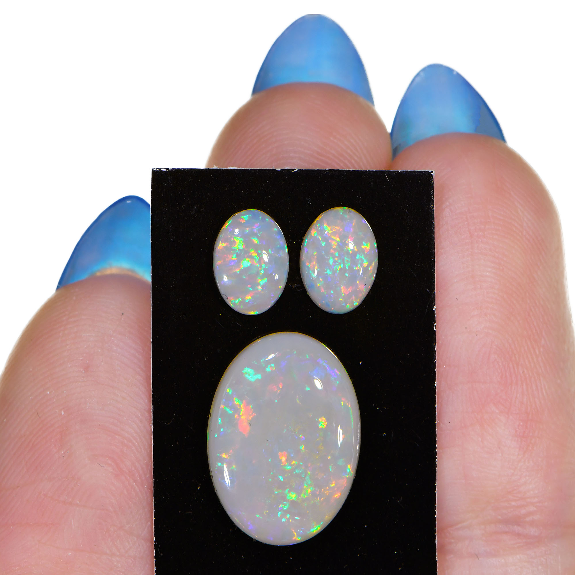 3 Pcs Calibrated Oval Shape White Opal Parcel 3.36 ctw- hand shot