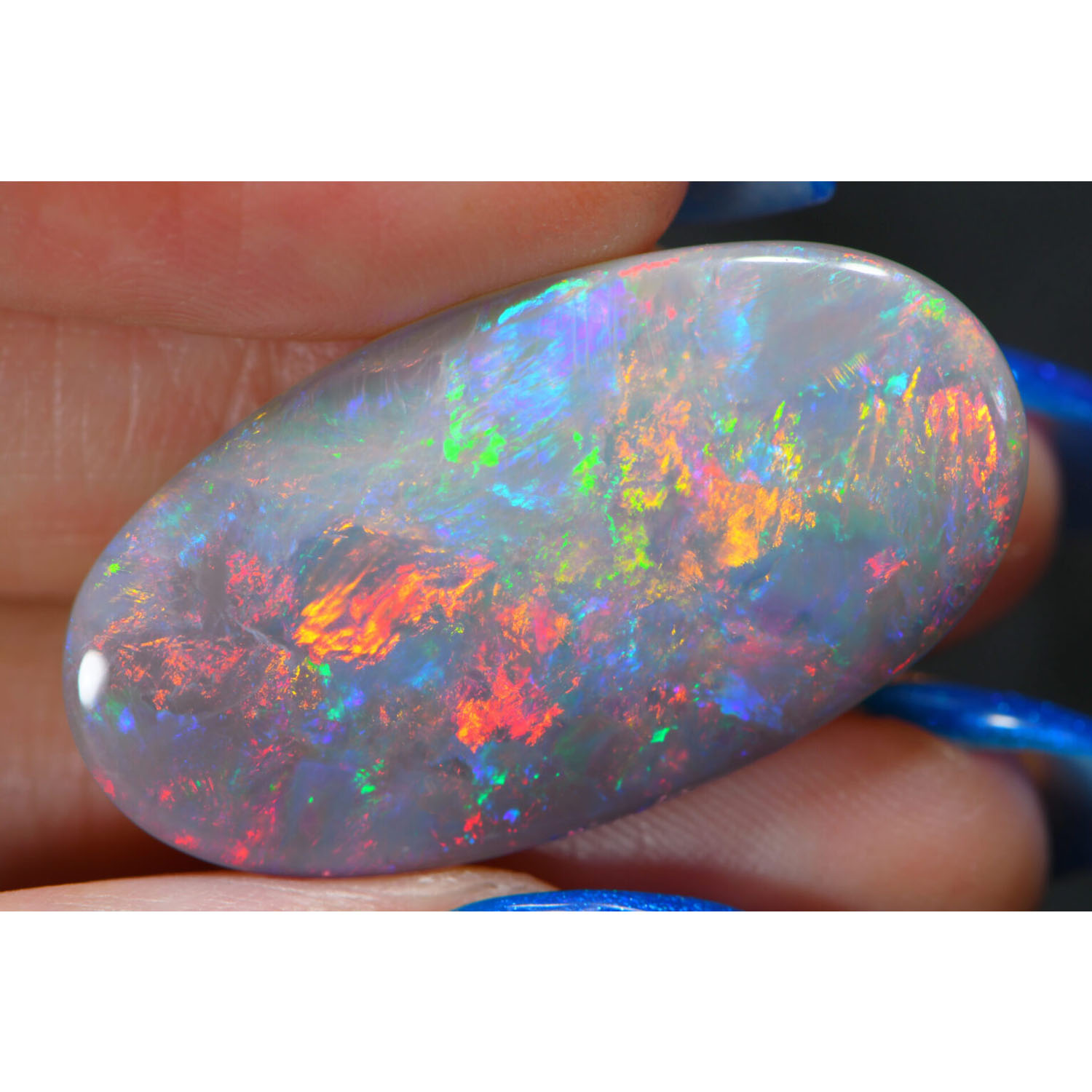 20.6ct Large Natural Dark Opal – Rainbow Fire-hand shot-1
