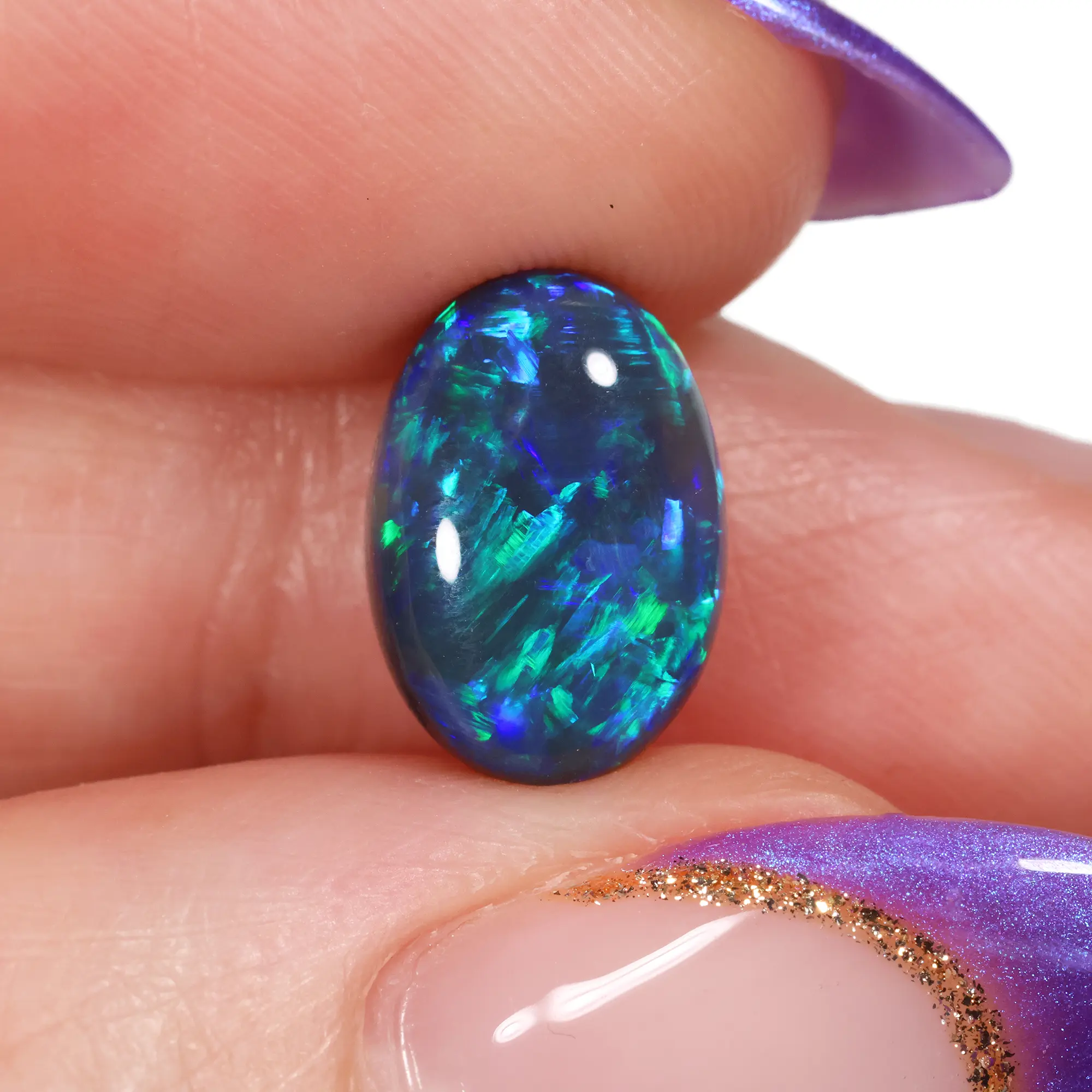 Black Opal Oval - 3.06 ct Green Blue Natural Stone - hand shot
