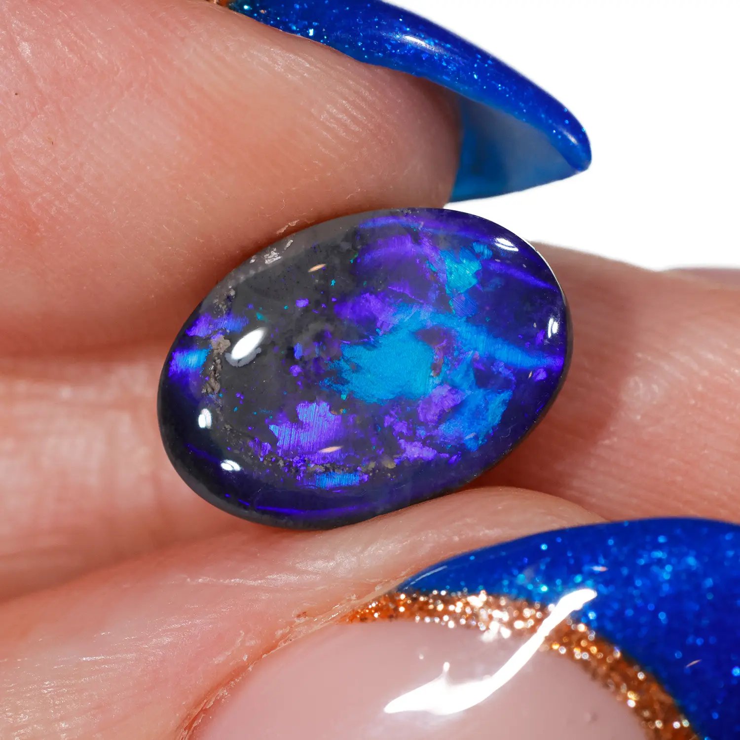 3.82ct Natural Black Opal Rolling Cat’s Eye Pattern-hand shot1