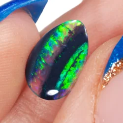0.77ct Natural Black Opal Pear Cut Neon Bright Yellow Green-hand shot