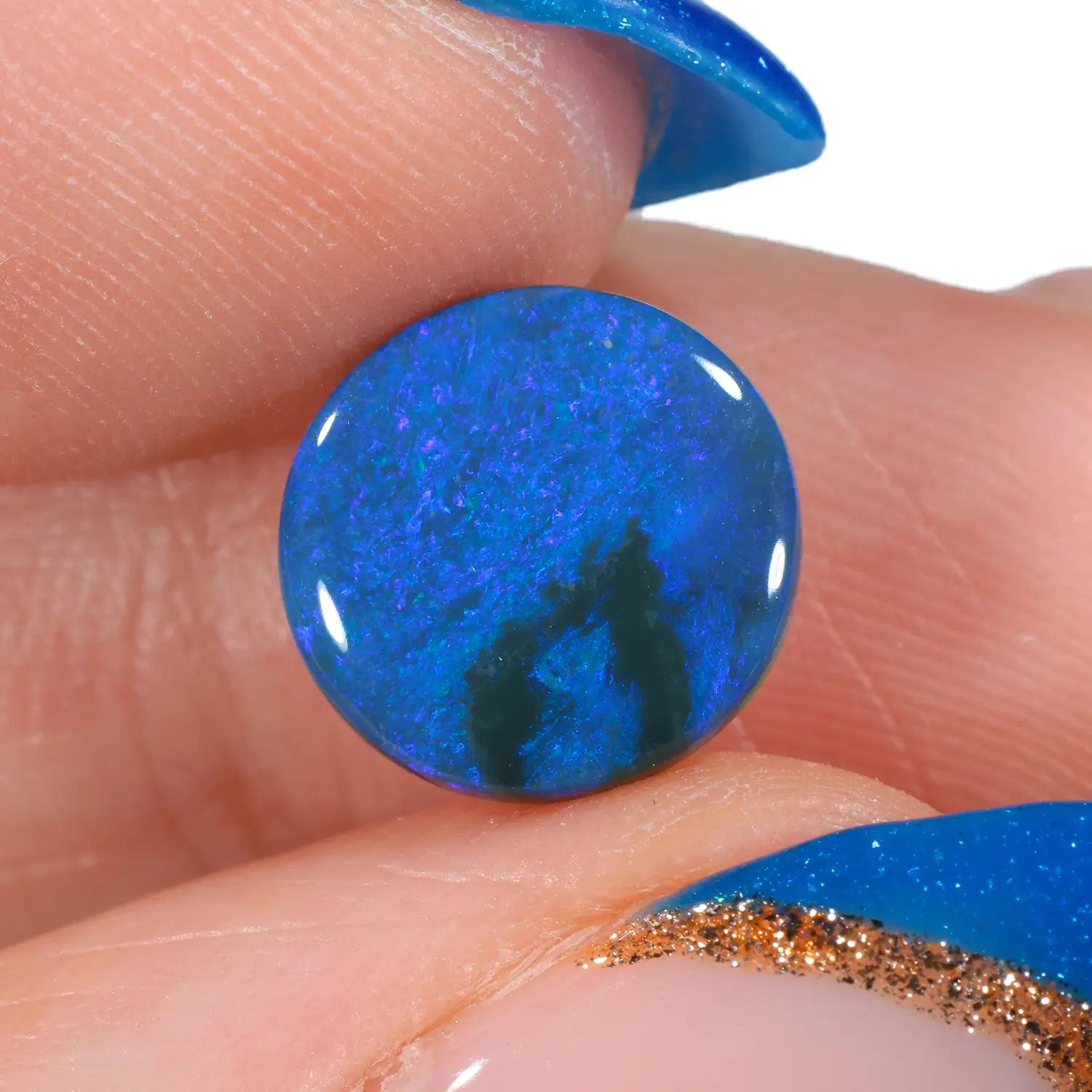 1.94ct Natural Black Opal Round with Blue and Green Fire-hand shot1