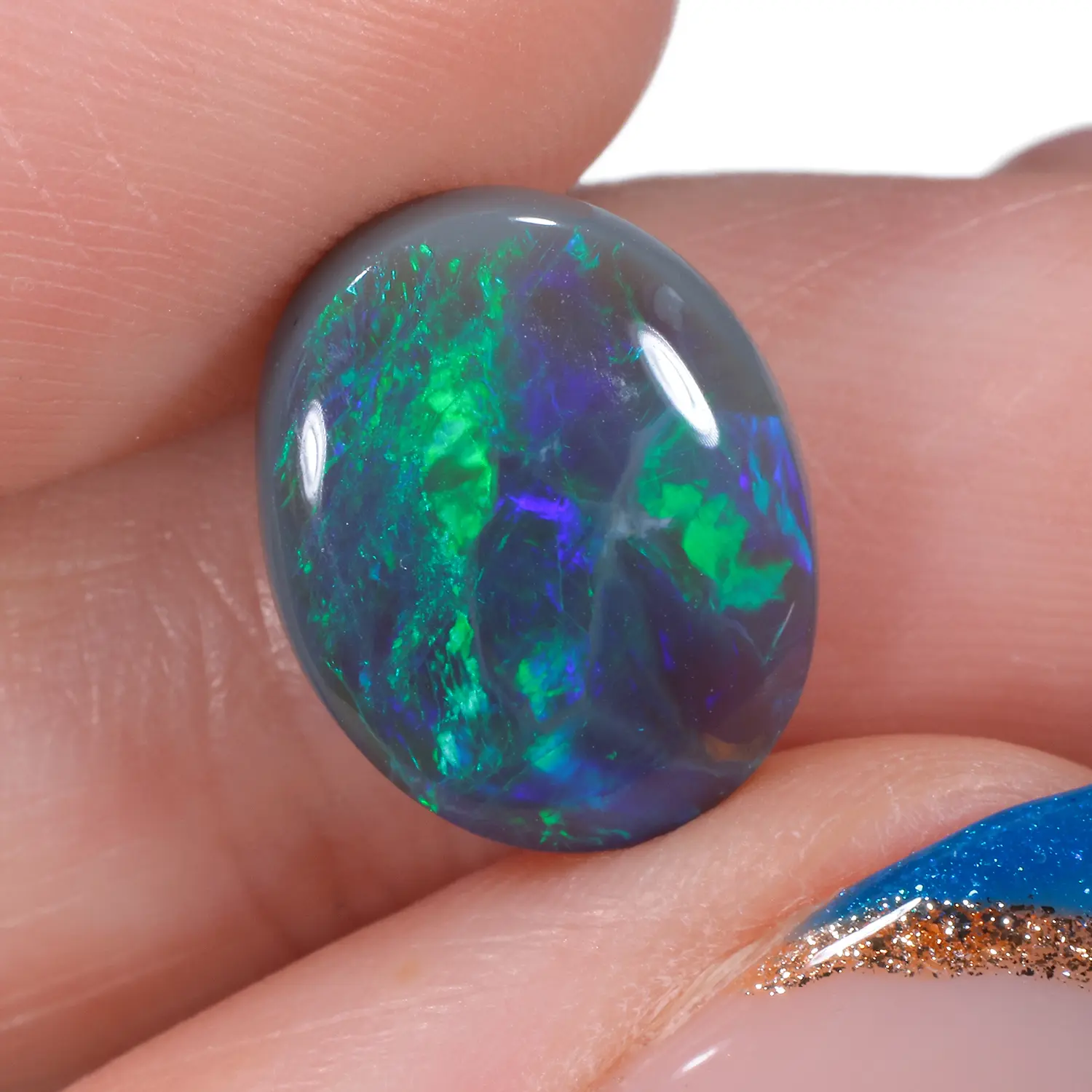 3.27ct Natural Dark Opal Oval Green Blue-hand shot