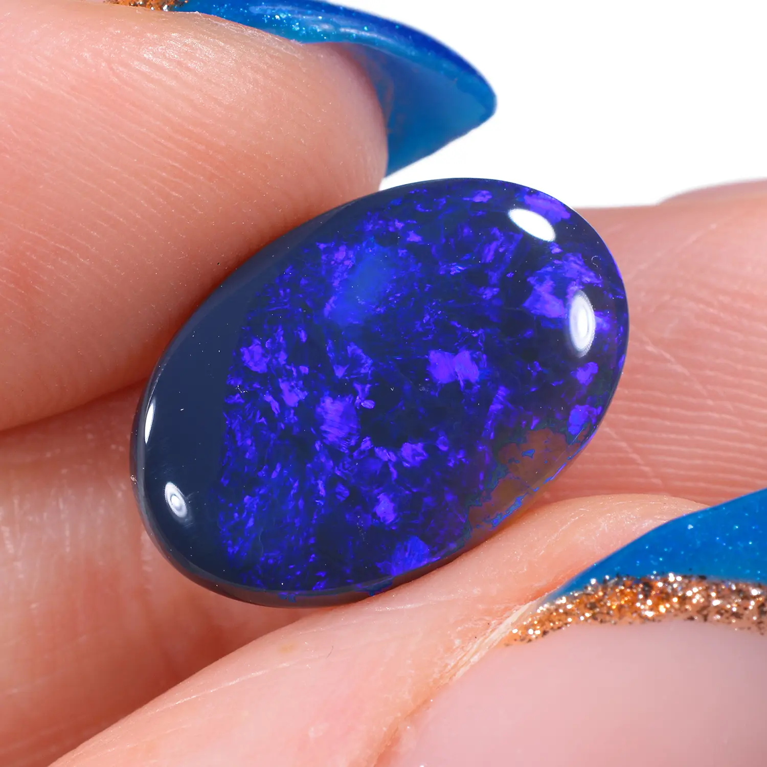 3ct Natural Australian Black Opal Oval - hand shot1