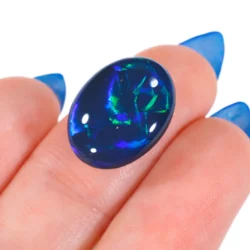 8.71ct Natural Black Opal Chinese Writing Pattern - hand shot1