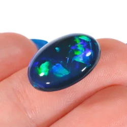 8.71ct Natural Black Opal Chinese Writing Pattern - hand shot2