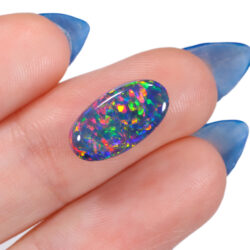 4.56ct Top-Grade Natural Black Opal Oval Cut with Intense Multicolor Play-of-Color from Lightning Ridge, Australia. Hand shot