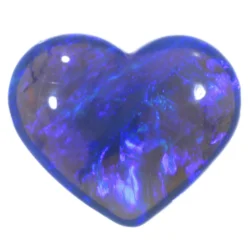 0.8ct solid black crystal opal heart on white background, displaying vivid electric blue and violet play-of-colour across a dark translucent body, Lightning Ridge Australia