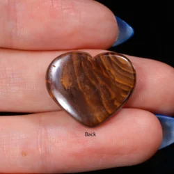 Back view of a 14.75ct solid boulder opal heart cabochon showing the natural banded brown and amber ironstone host rock, Winton Queensland Australia