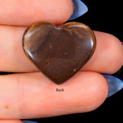 Back view of a 16.5ct solid boulder opal heart cabochon showing the natural dark brown ironstone host rock base, Winton Queensland Australia