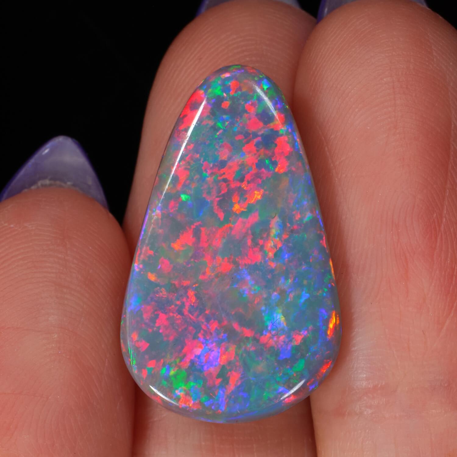 10.8ct Cherry Blossom Dark Opal - hand shot