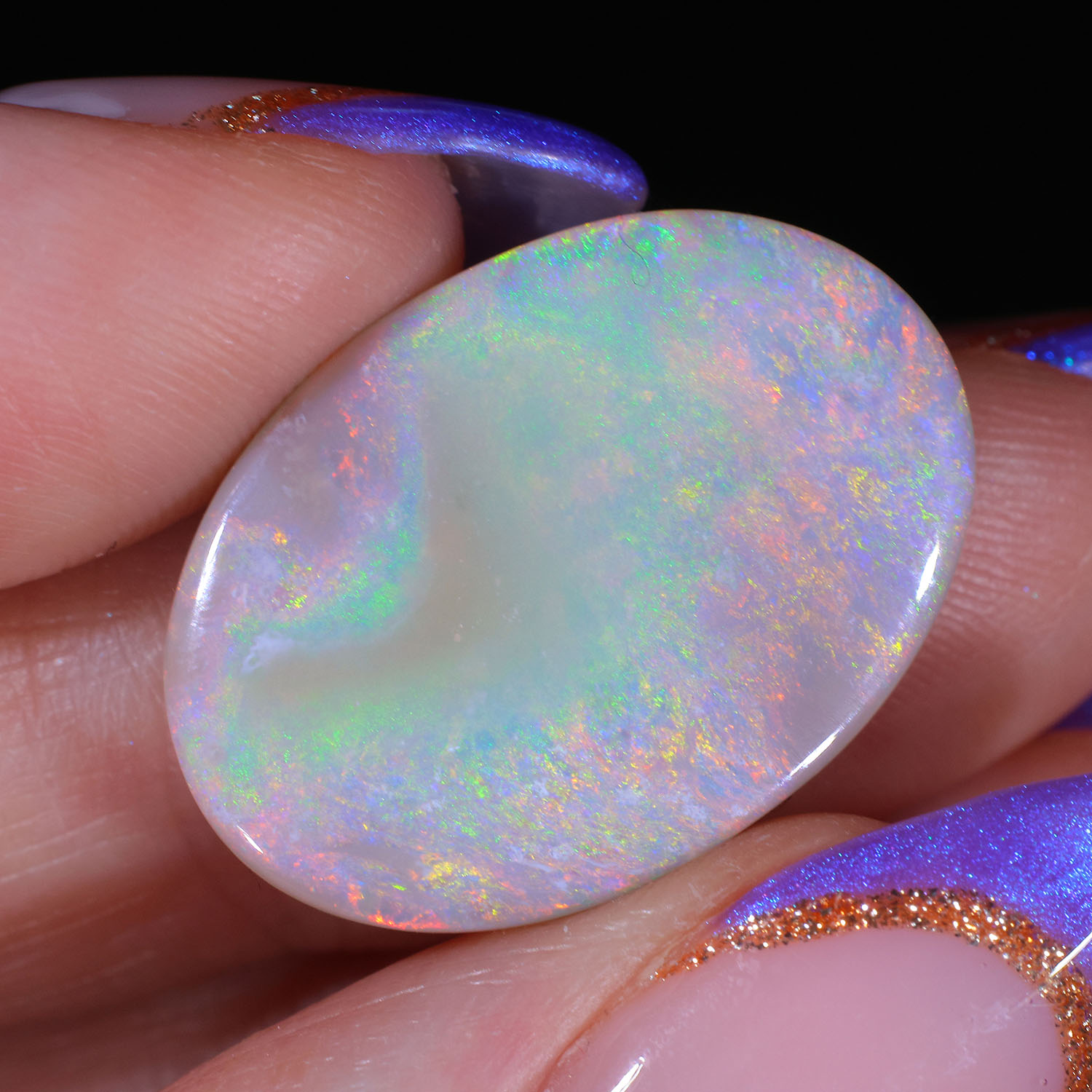 11.13ct Natural Dark Opal - Oval Pastel Sunset Fire-hand shot1