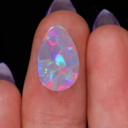 3.64ct Natural Dark Opal -Teardrop Rainbow Fire - hand shot1