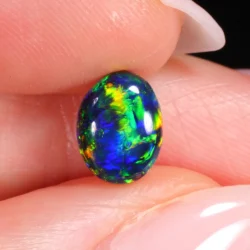 Hand image to show opal scale and fire variation