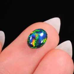 1.61ct Natural Black Opal Oval Neon Multicolor Fire-hand shot1