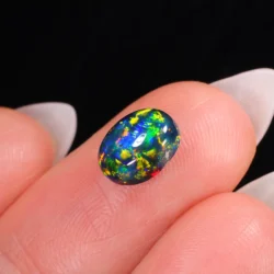1.61ct Natural Black Opal Oval Neon Multicolor Fire-hand shot4