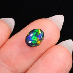 1.61ct Natural Black Opal Oval Neon Multicolor Fire-hand shot5