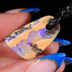 Pendant in hand showing scale and natural details