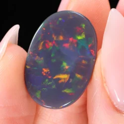 10.72ct Natural Black Opal Oval Multicolor Fire - hand shot2 xx1879
