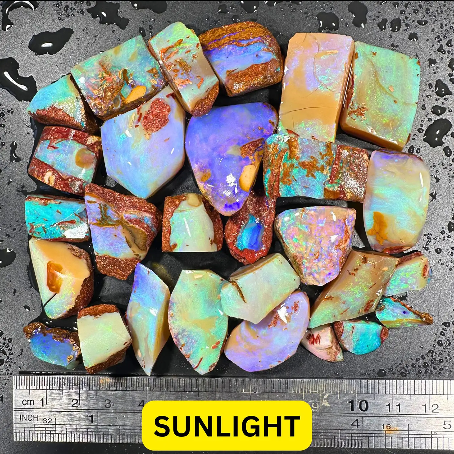 28 Piece Crystal Boulder Opal Rubs Parcel 629 ctw-sun light