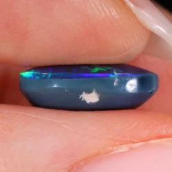 Side view showing opal dome and natural blue potch with visible inclusion