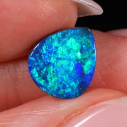 Detailed close up of opal surface revealing rolling pattern fire-xx1872