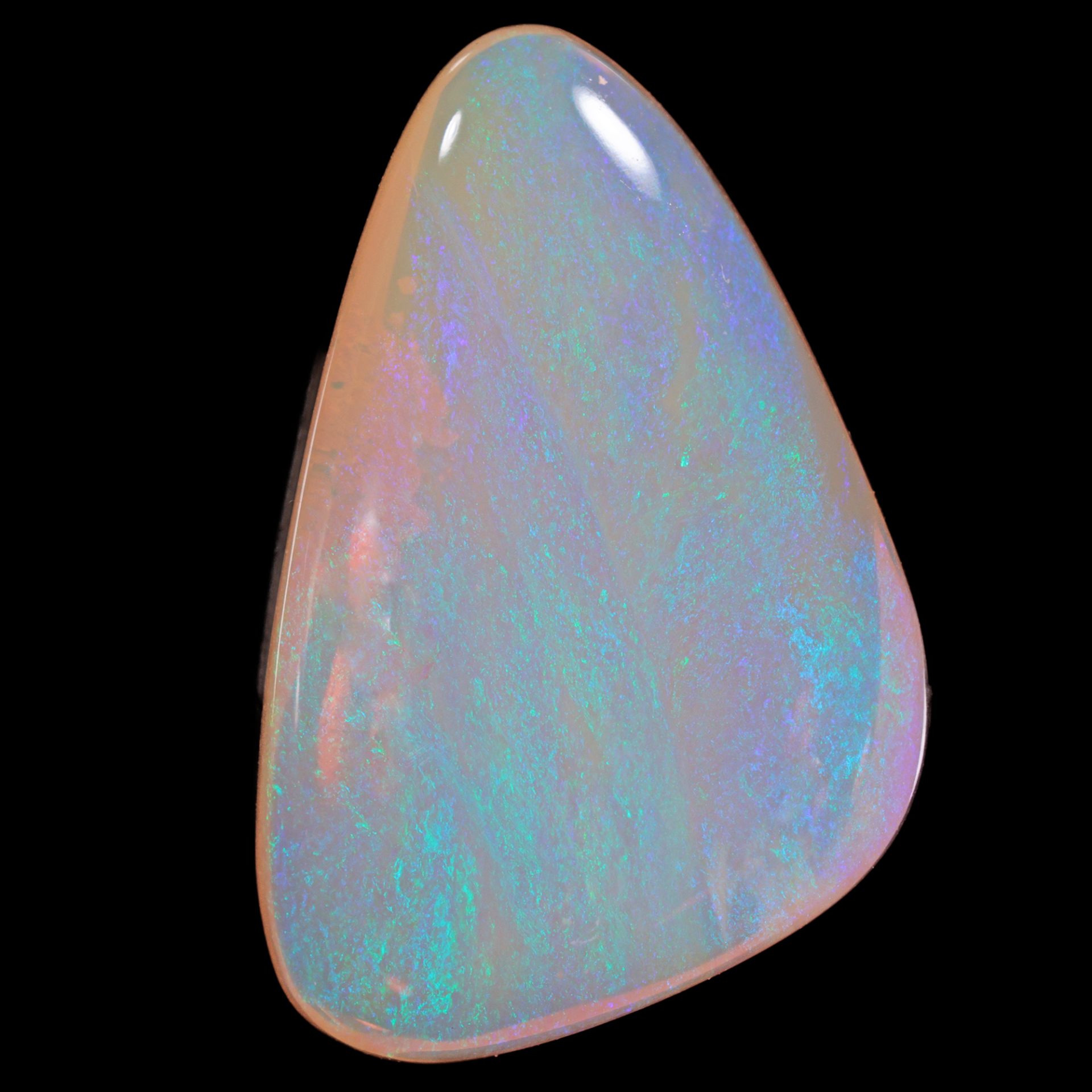 Crystal boulder opal 32.9 ct triangle on a black background showing a close view of green and lavender fire.