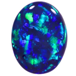 Close-up of a 5.47 carat oval black opal displaying vivid blue and green play-of-color flashes across a dark body tone, polished to a smooth cabochon, on a white background