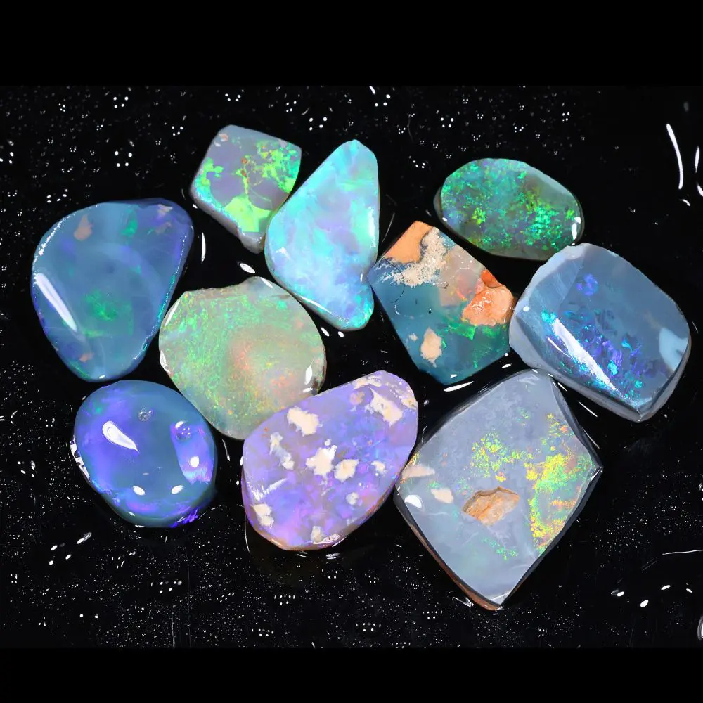 Gem Lightning Ridge opal rubs displaying green blue and multicolor fire across black dark and crystal opal stones