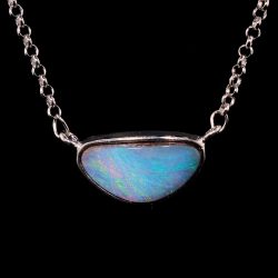 24.7ct Australian boulder opal from Winton featuring ocean blue and green fire set in a horizontal sterling silver pendant. Natural untreated solid opal.