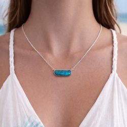 29.7ct Australian boulder opal pendant showing deep blue and green ocean inspired fire set in an elegant silver bezel. Natural untreated solid opal on 18 inch chain.