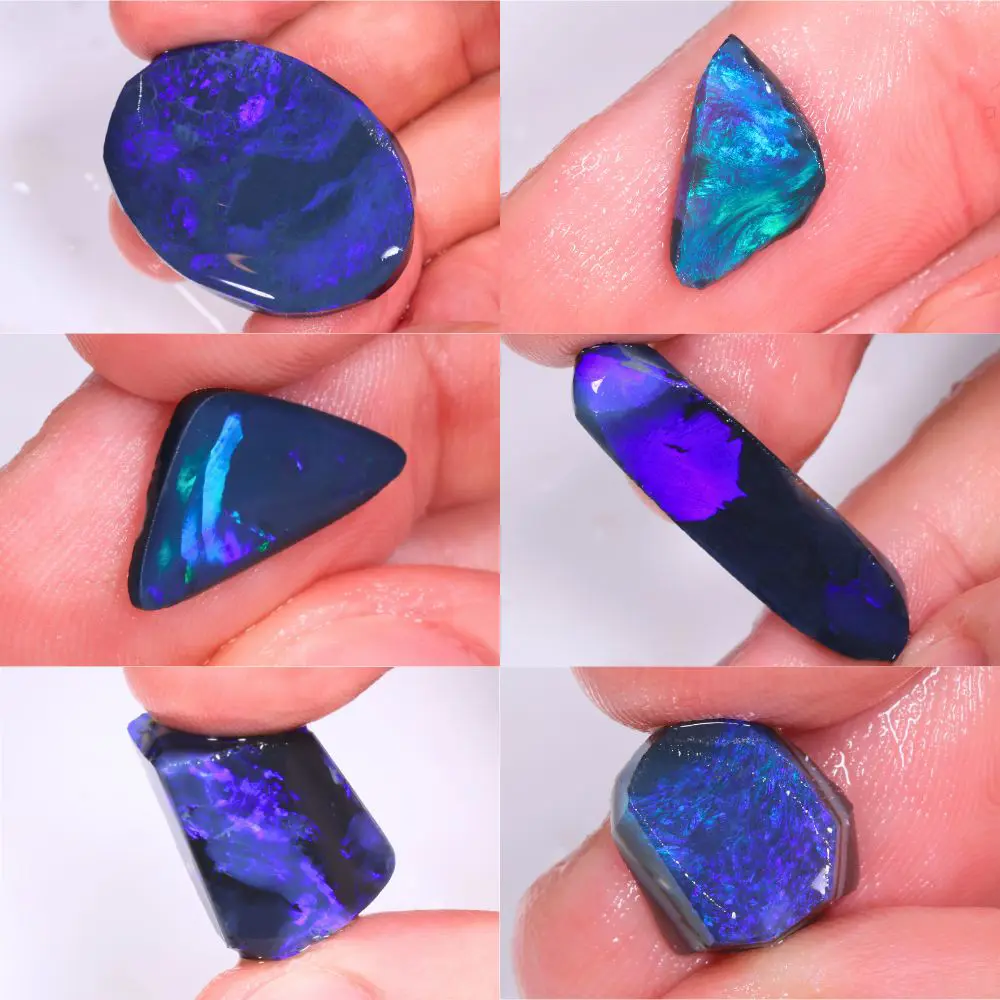 Close up hand views of Lightning Ridge black opal rubs showing vivid blue purple fire and cutting potential