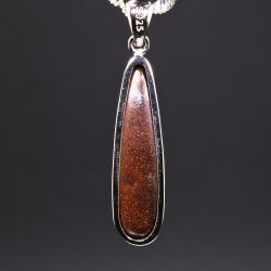 Rear view of Australian boulder opal pendant showing natural ironstone backing