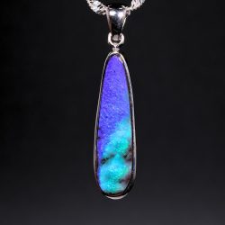 Natural Australian boulder opal pendant in sterling silver displaying vivid blue and purple fire