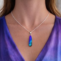 Boulder opal pendant necklace shown worn with elegant silver chain