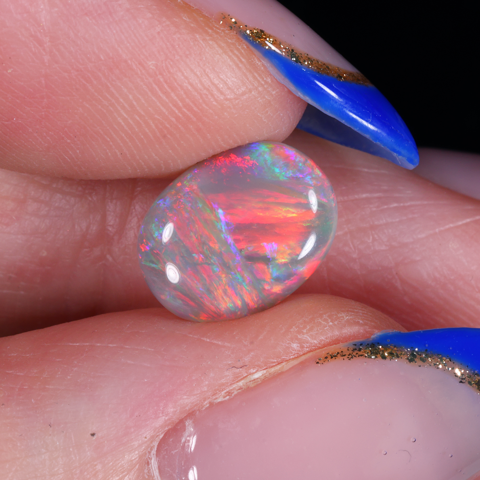 Natural dark opal from Lightning Ridge Australia 1.49ct oval polished cabochon.