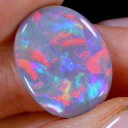 black-opal-metallic-red-pink-rainbow-fire-8-22ct-oval-gemstone