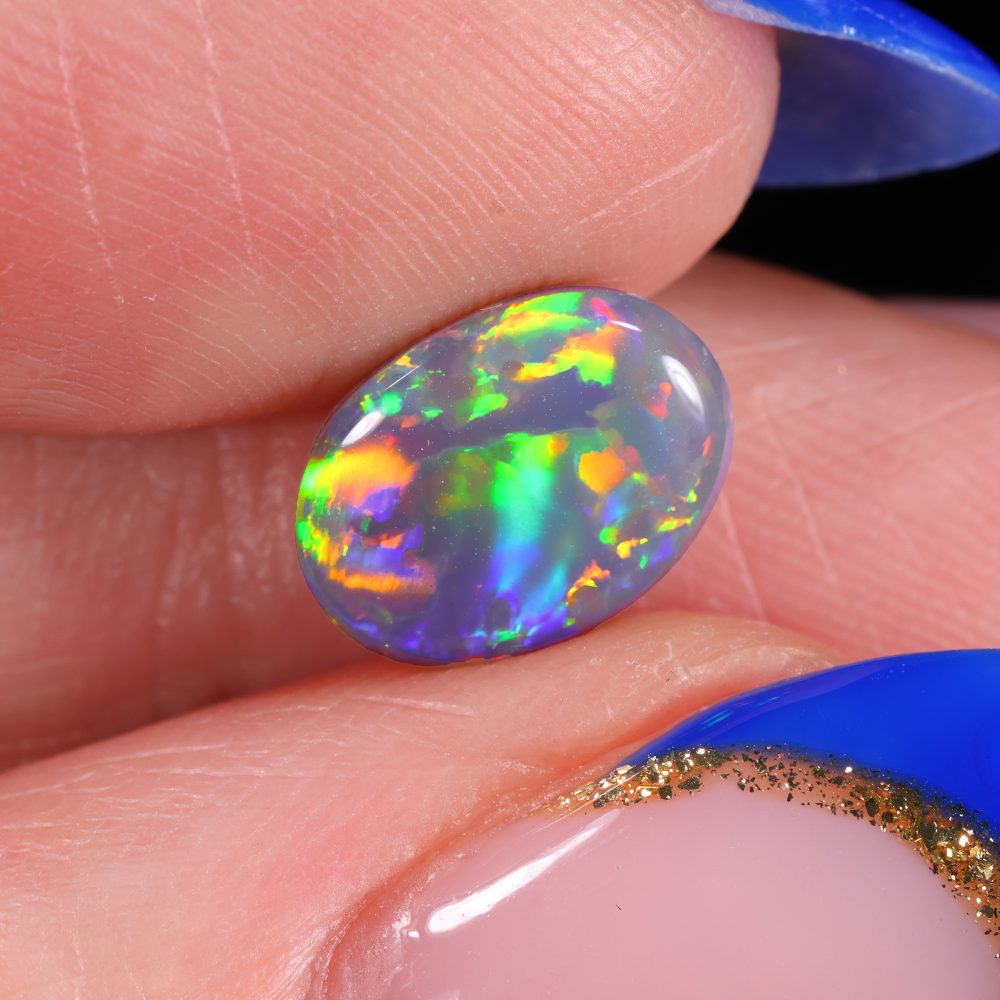 lightning-ridge-black-opal-colorful-fire-oval-cabochon-opal-galaxy